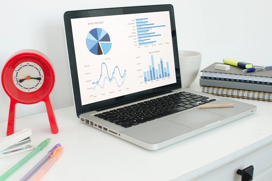 Laptop displaying sales analytics and data visualization charts — digital marketing insights and performance tracking.